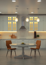 Photo of Stylish kitchen interior with modern furniture. Idea for design