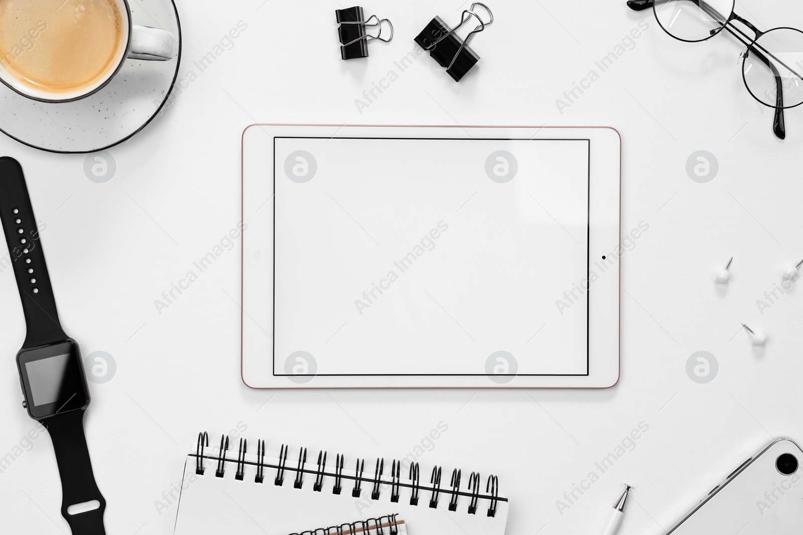 Photo of Flat lay composition with modern tablet on white background. Space for text