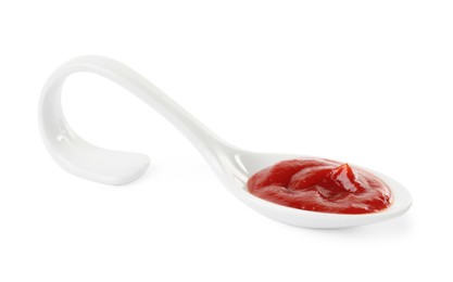 Photo of Ketchup in ceramic serving spoon isolated on white