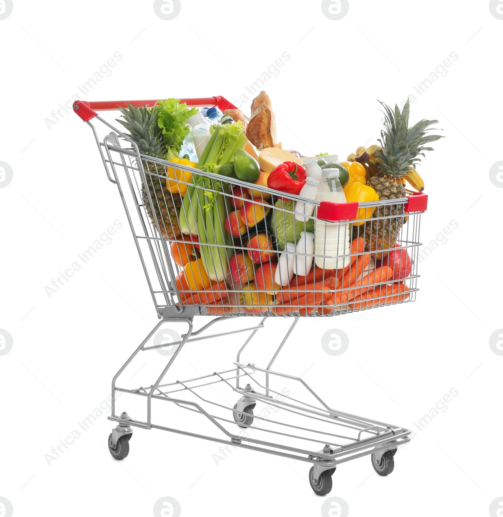 Photo of Shopping cart with groceries on white background