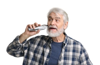 Senior man trimming beard on white background