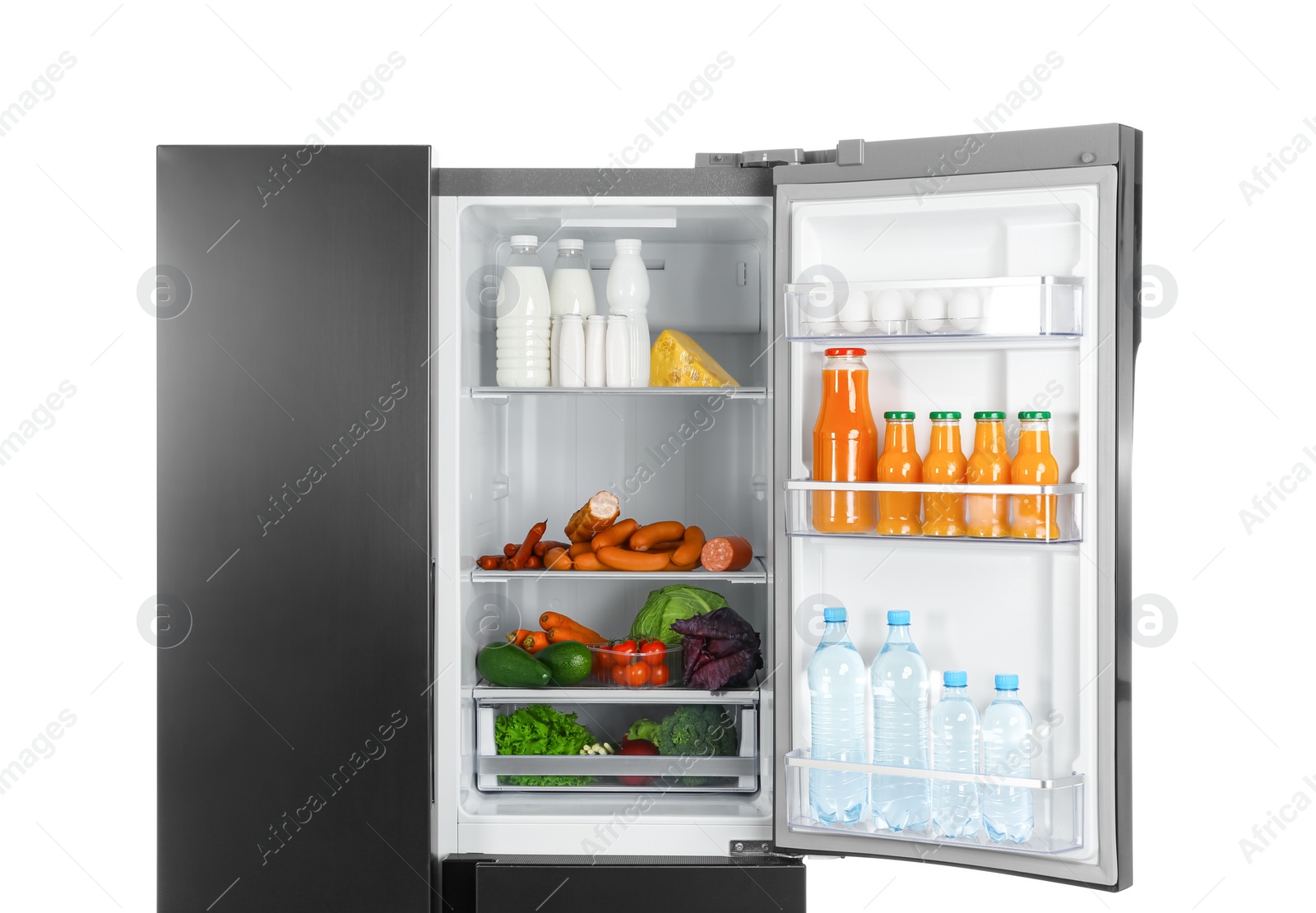 Photo of Open refrigerator filled with products isolated on white