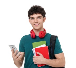 Portrait of student with backpack, notebooks, smartphone and headphones on white background
