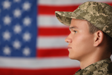 Male soldier in uniform against USA flag