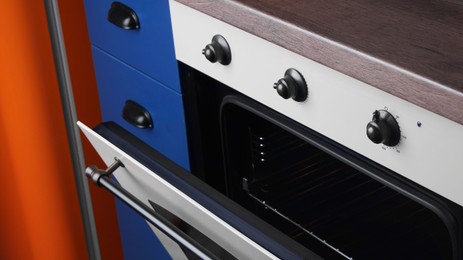 New stylish closed oven in kitchen. Cooking appliance