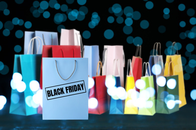 Image of Black Friday. Many shopping bags and blurred lights