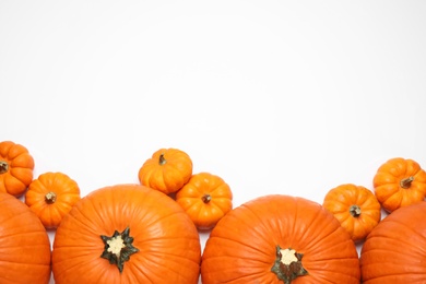 Photo of Fresh ripe pumpkins on white background, top view. Space for text