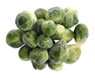 Photo of Pile of frozen Brussels sprouts isolated on white, top view. Vegetable preservation