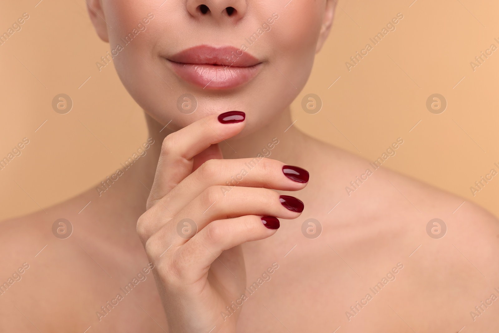 Photo of Woman with beautiful lips on beige background, closeup