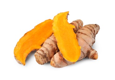 Photo of Whole and cut turmeric roots isolated on white
