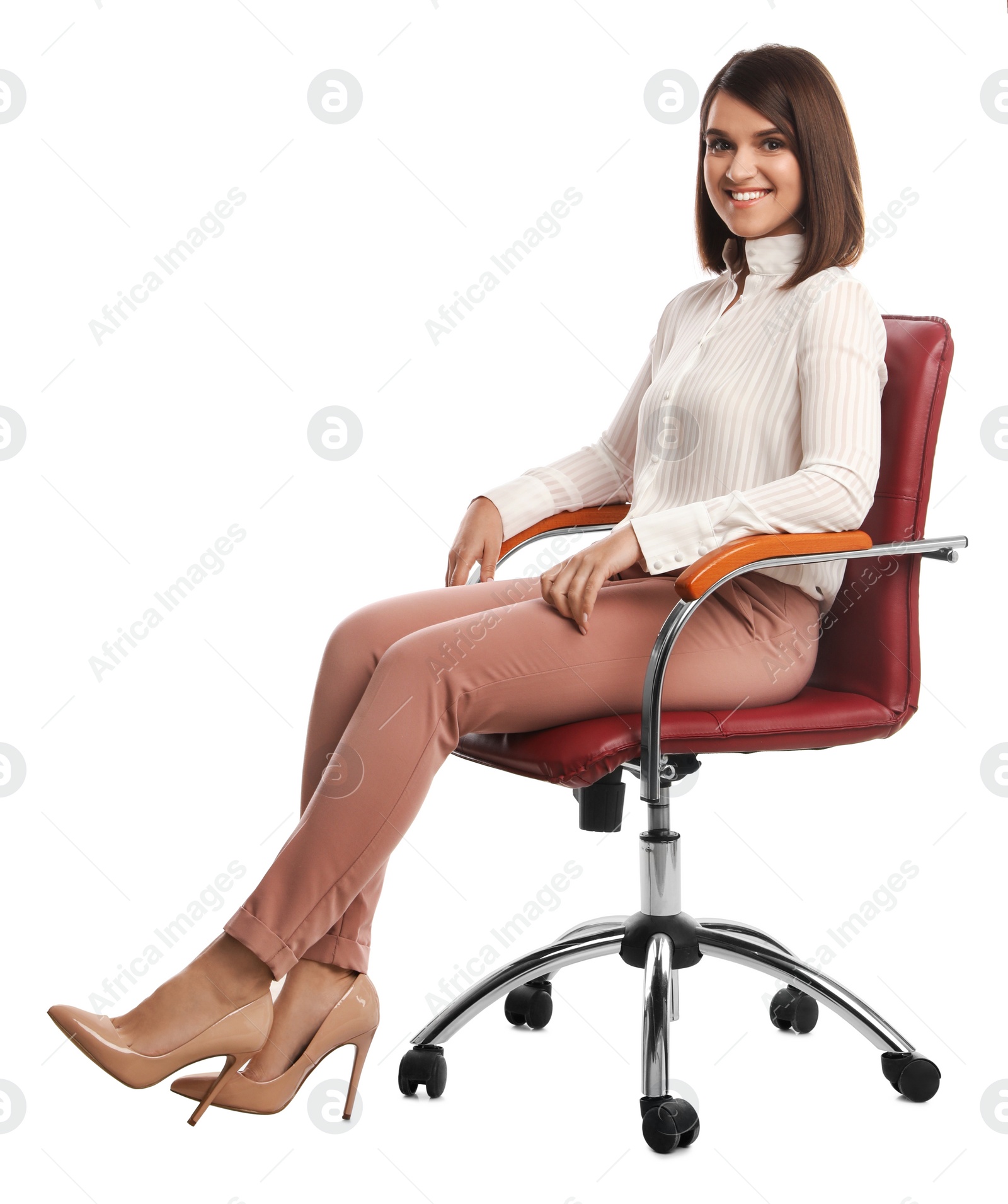 Photo of Young businesswoman sitting in comfortable office chair on white background