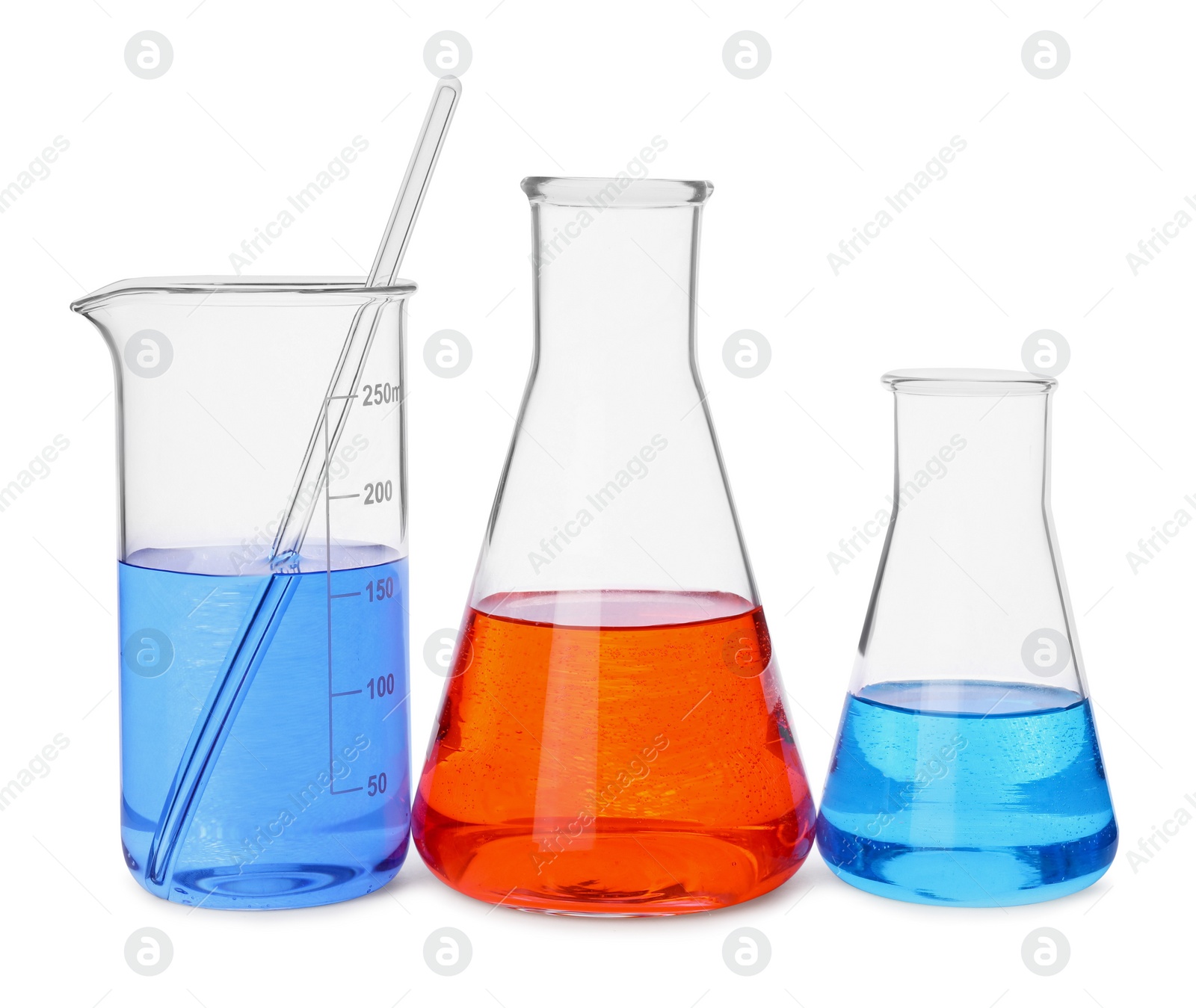 Photo of Different laboratory glassware with colorful liquids on white background