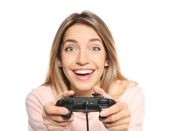 Emotional young woman playing video games with controller isolated on white