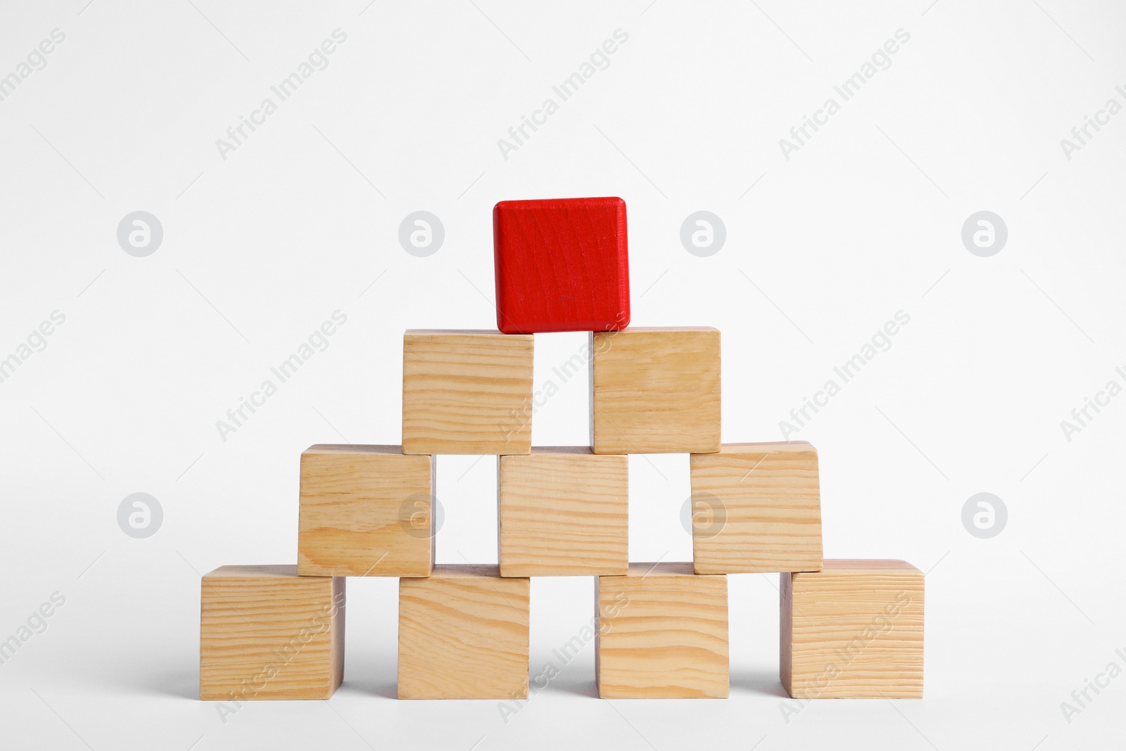 Photo of Blank wooden cubes and red one stacked on white background