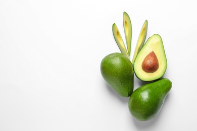 Photo of Composition with ripe fresh avocados on white background