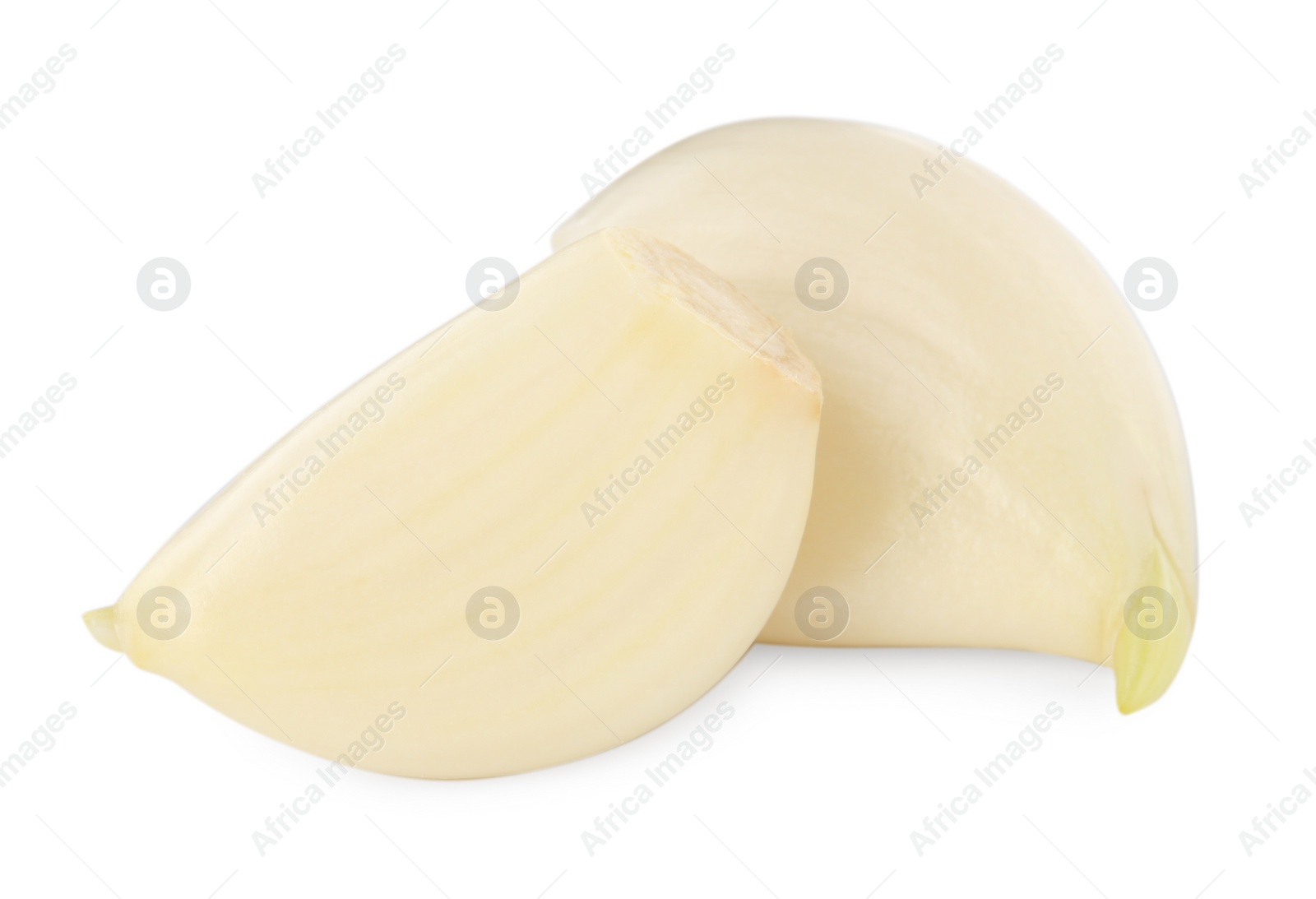 Photo of Peeled cloves of fresh garlic isolated on white