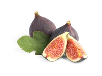Photo of Cut and whole ripe figs isolated on white
