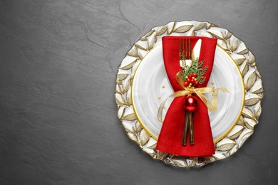 Beautiful Christmas table setting on grey background, top view. Space for text