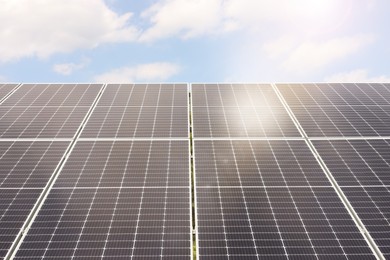 Photo of Solar panels outdoors on sunny day. Alternative energy