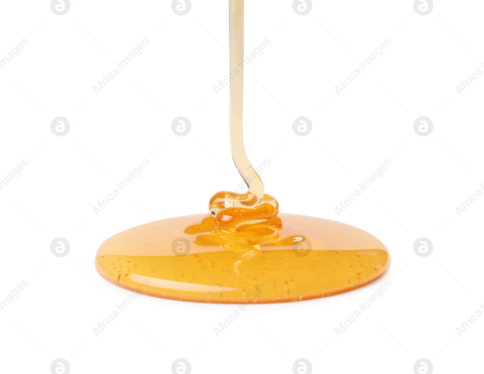 Photo of Pouring tasty natural honey isolated on white