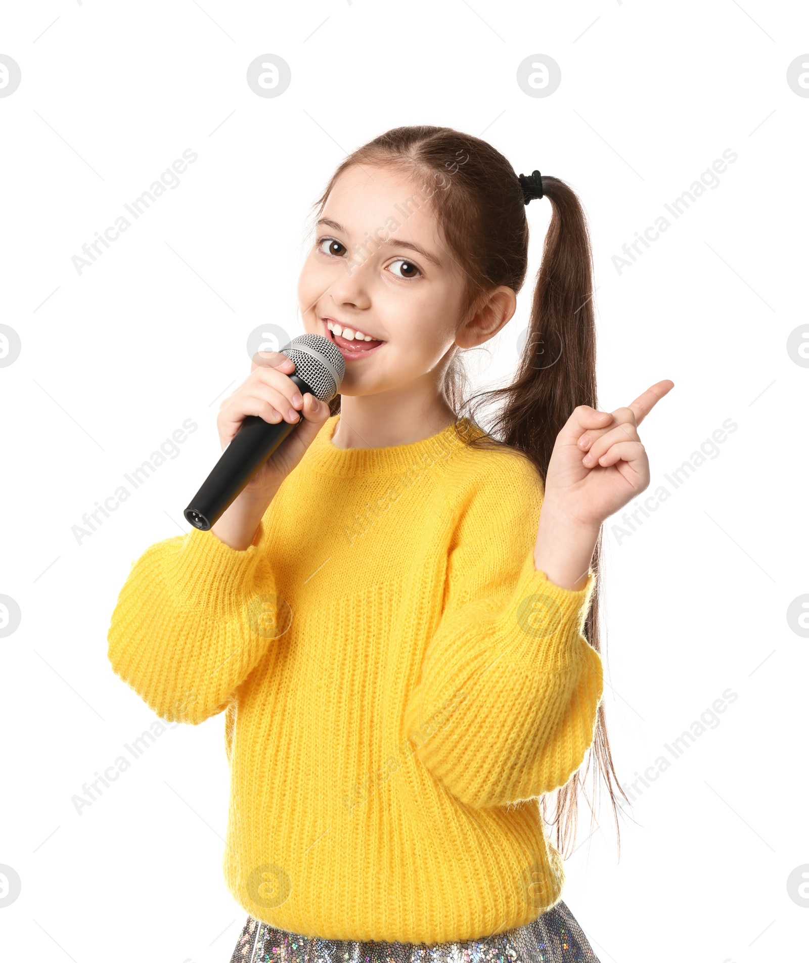 Photo of Little girl singing into microphone on white background