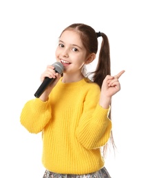 Photo of Little girl singing into microphone on white background