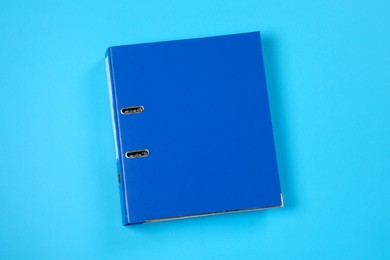 One office folder on light blue background, top view