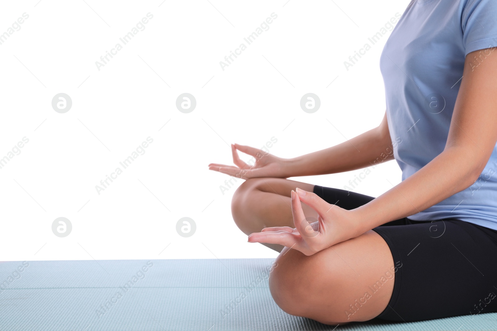 Photo of African-American woman meditating on yoga mat against white background, closeup