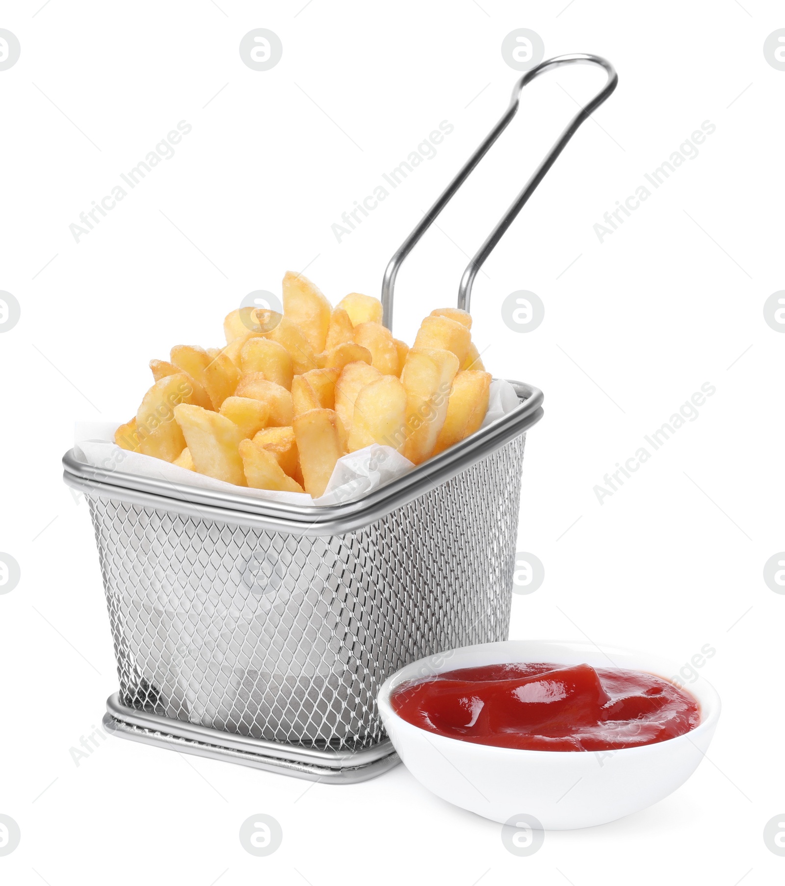 Photo of Delicious French fries in metal basket and ketchup isolated on white