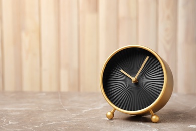 Photo of Modern alarm clock on table. Time management