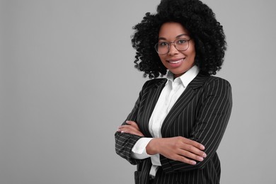 Photo of Young businesswoman in formal outfit on grey background. Space for text