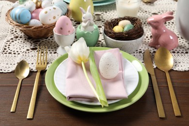 Festive table setting with painted eggs. Easter celebration