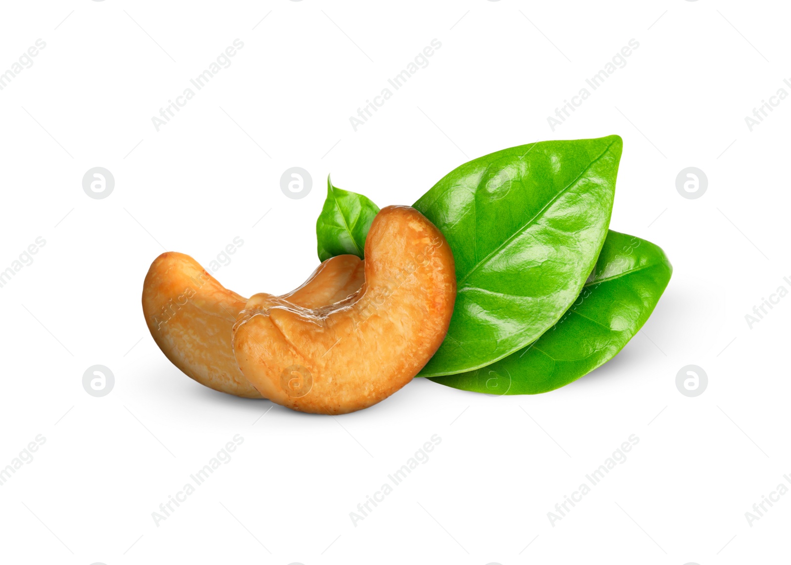 Image of Tasty cashew nuts and fresh green leaves on white background 