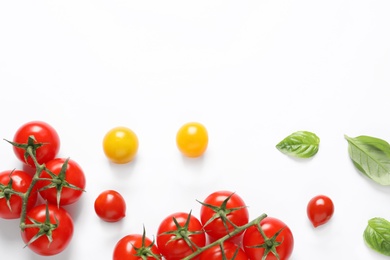 Composition with ripe cherry tomatoes and basil leaves on white background, top view