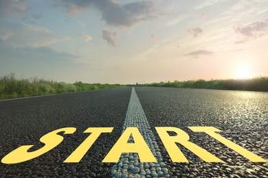 Image of New beginnings. Word Start on asphalt road outdoors