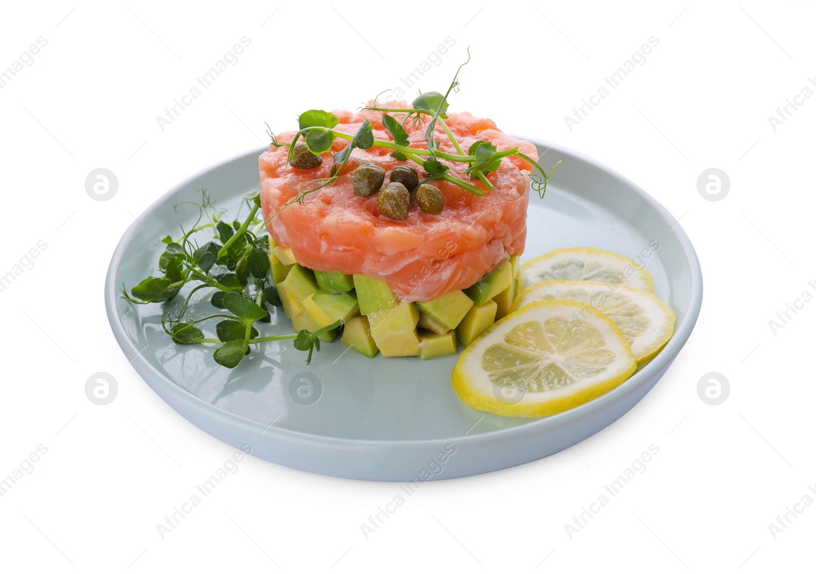 Photo of Tasty salmon tartare with avocado, lemon, capers and microgreens isolated on white