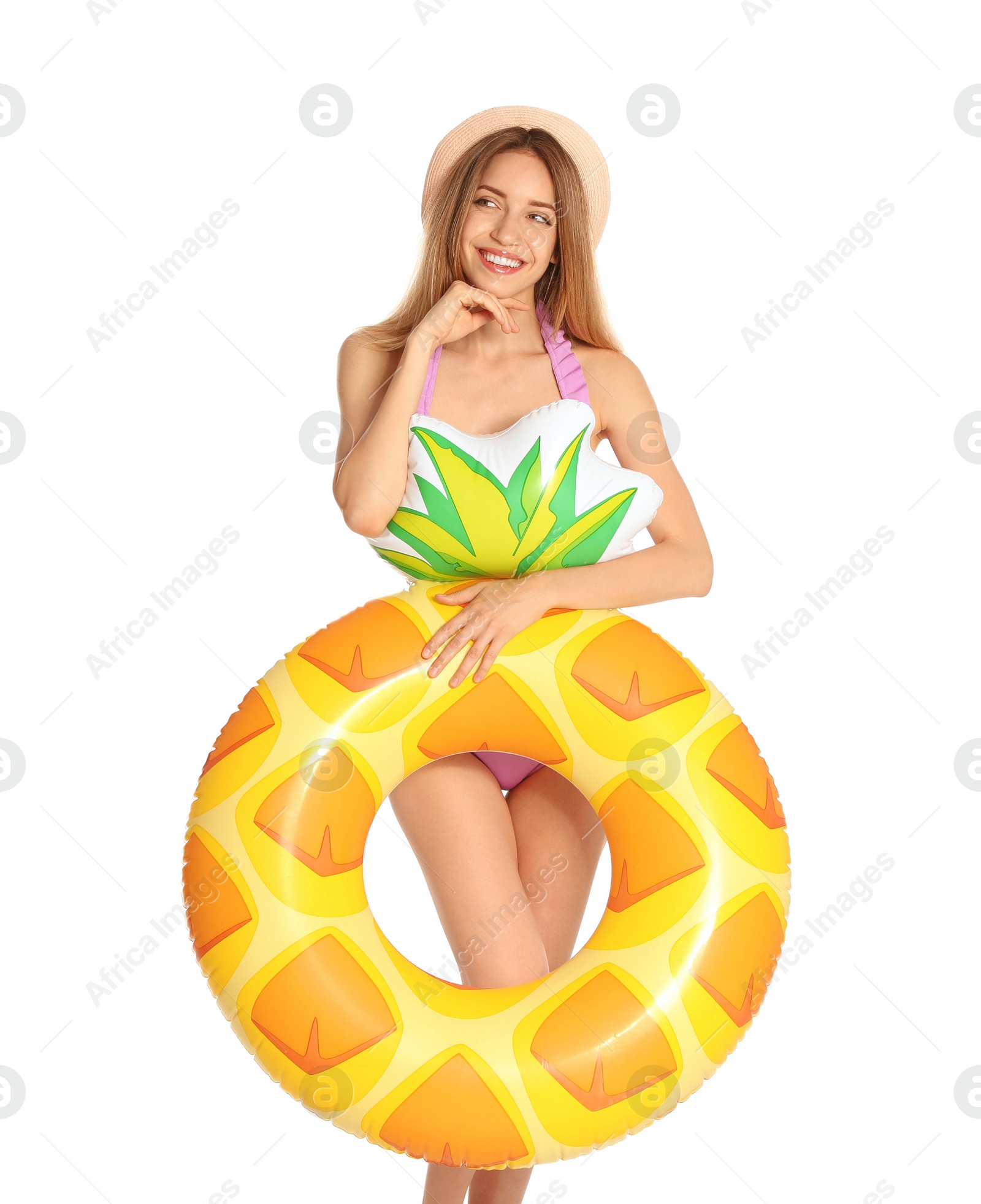 Photo of Beautiful young woman in stylish bikini with pineapple inflatable ring on white background