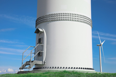 Photo of Entrance to wind turbine power generator outdoors. Alternative energy source