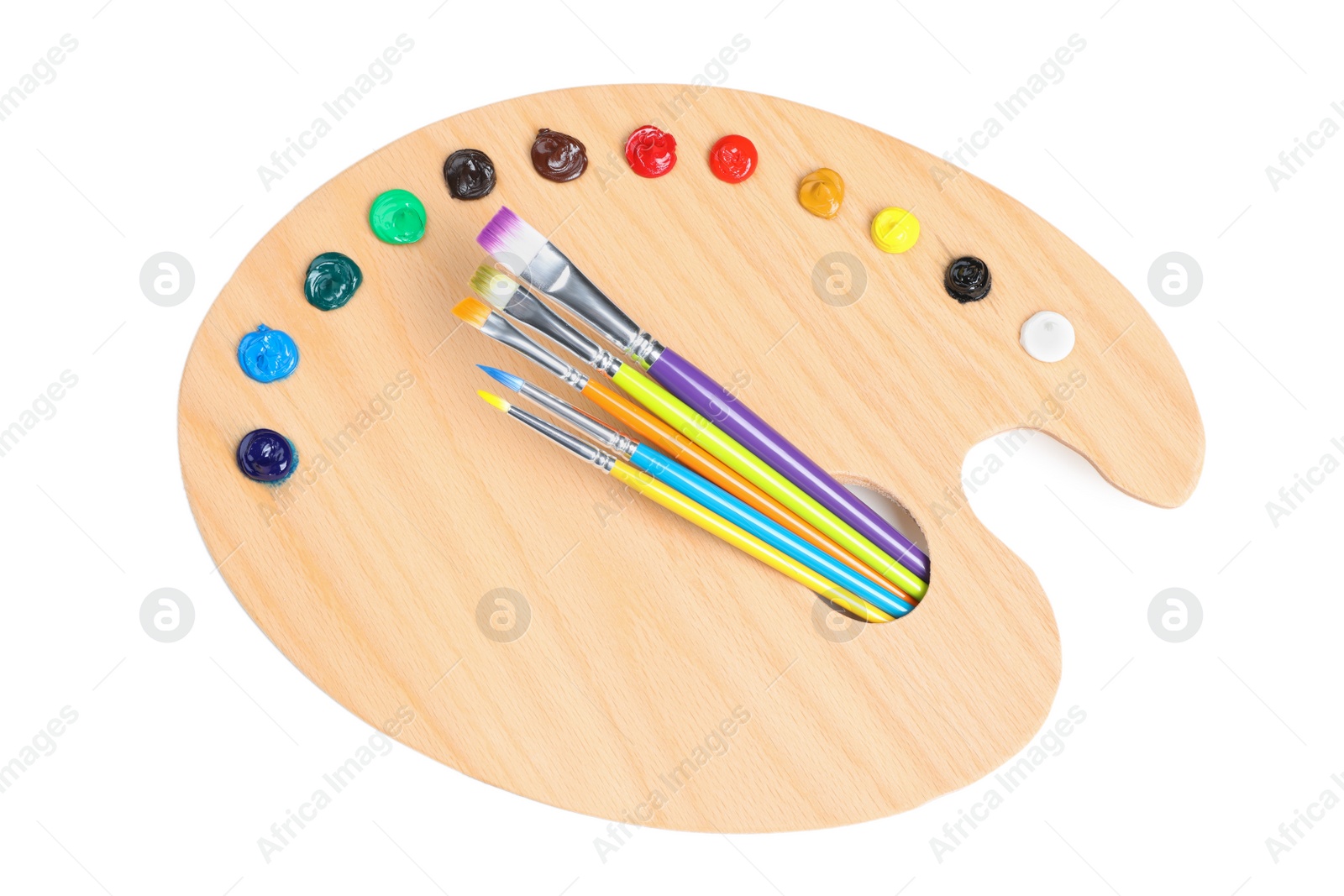 Photo of Palette with paints and brushes on white background, top view. Artist equipment