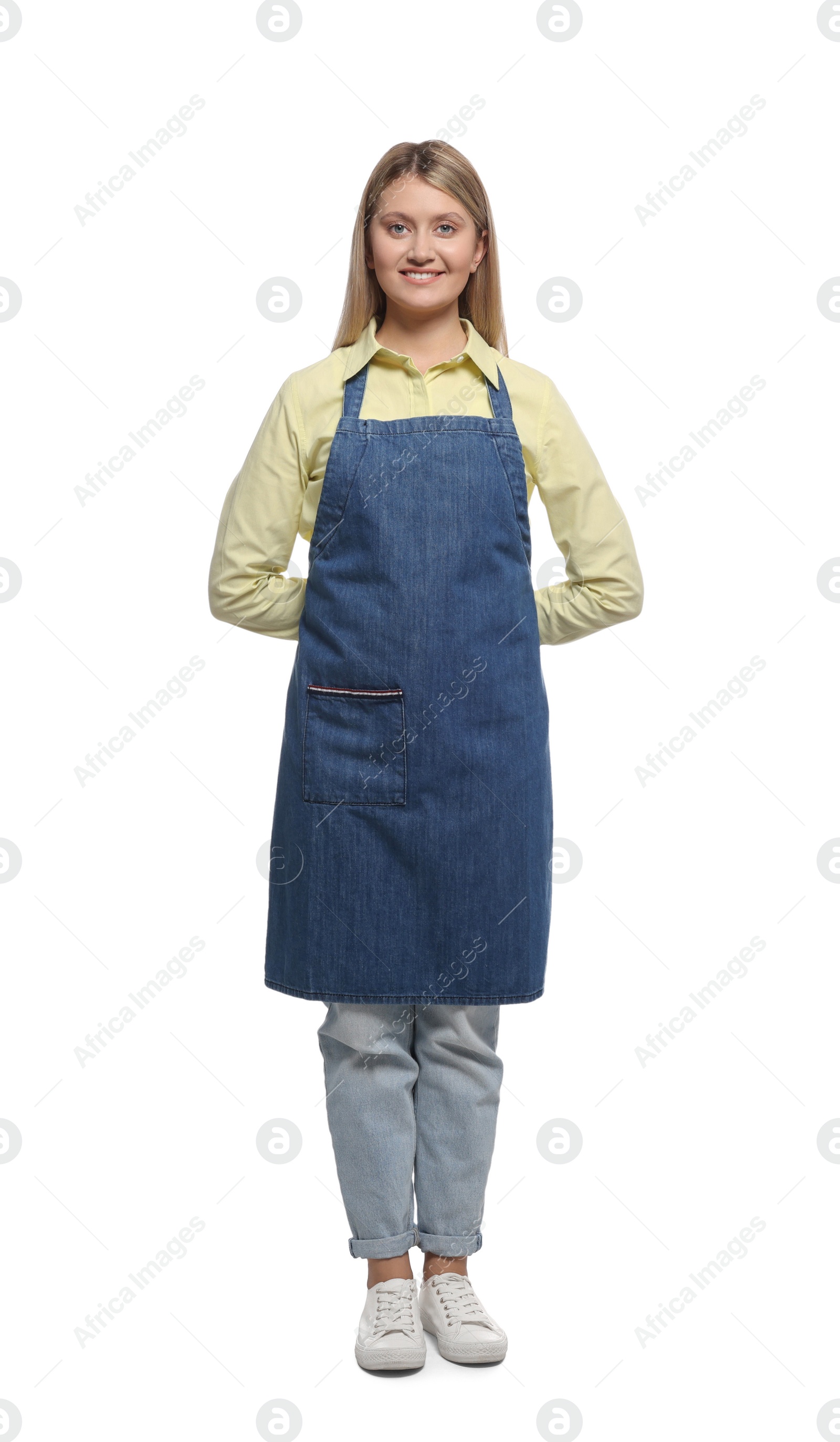 Photo of Beautiful young woman in denim apron on white background