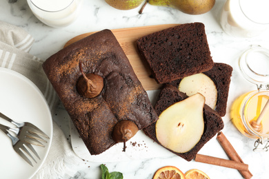 Photo of Flat lay composition with tasty pear bread on white marble table. Homemade cake