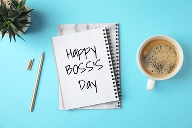 Image of Notebook with phrase Happy Boss`s Day, coffee and plant on light blue table, flat lay