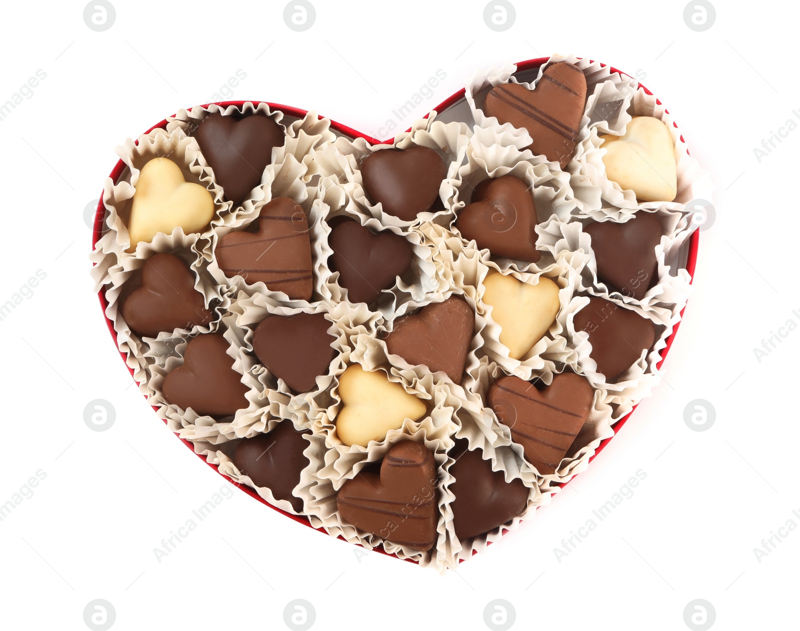 Photo of Delicious heart shaped chocolate candies in box isolated on white, top view