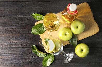 Photo of Flat lay composition with delicious apple cider on wooden table, space for text