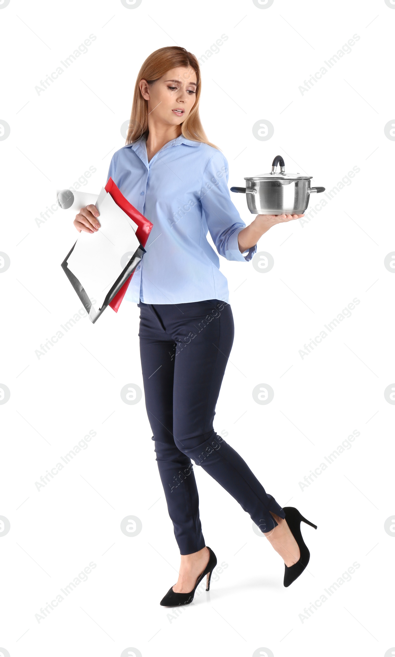 Photo of Full length portrait of businesswoman holding saucepan and documents on white background. Combining life and work