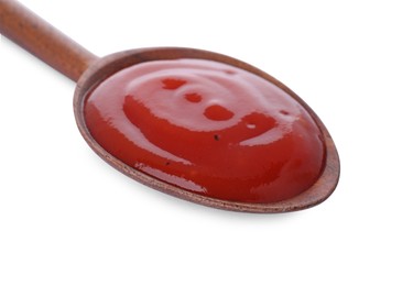 Photo of Wooden spoon with tasty fresh ketchup isolated on white