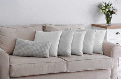 Photo of Sofa with pillows in modern living room interior