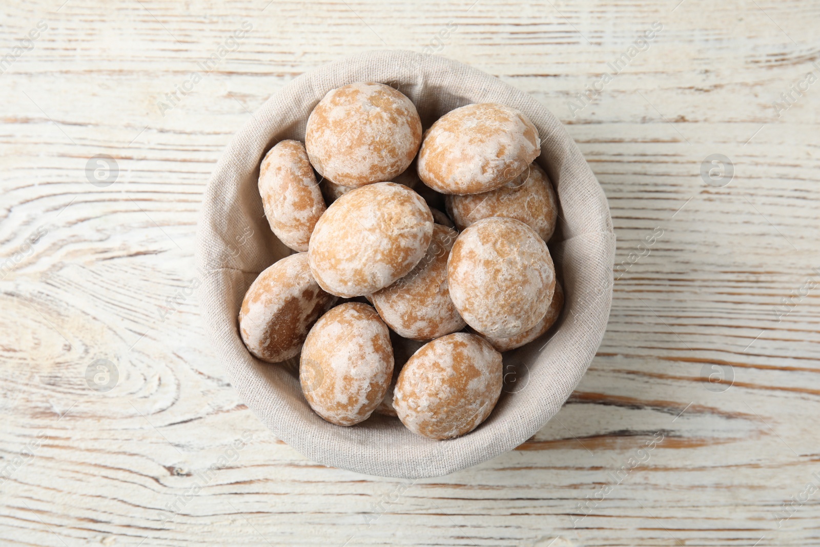 Photo of Tasty homemade gingerbread cookies on white wooden table, top view