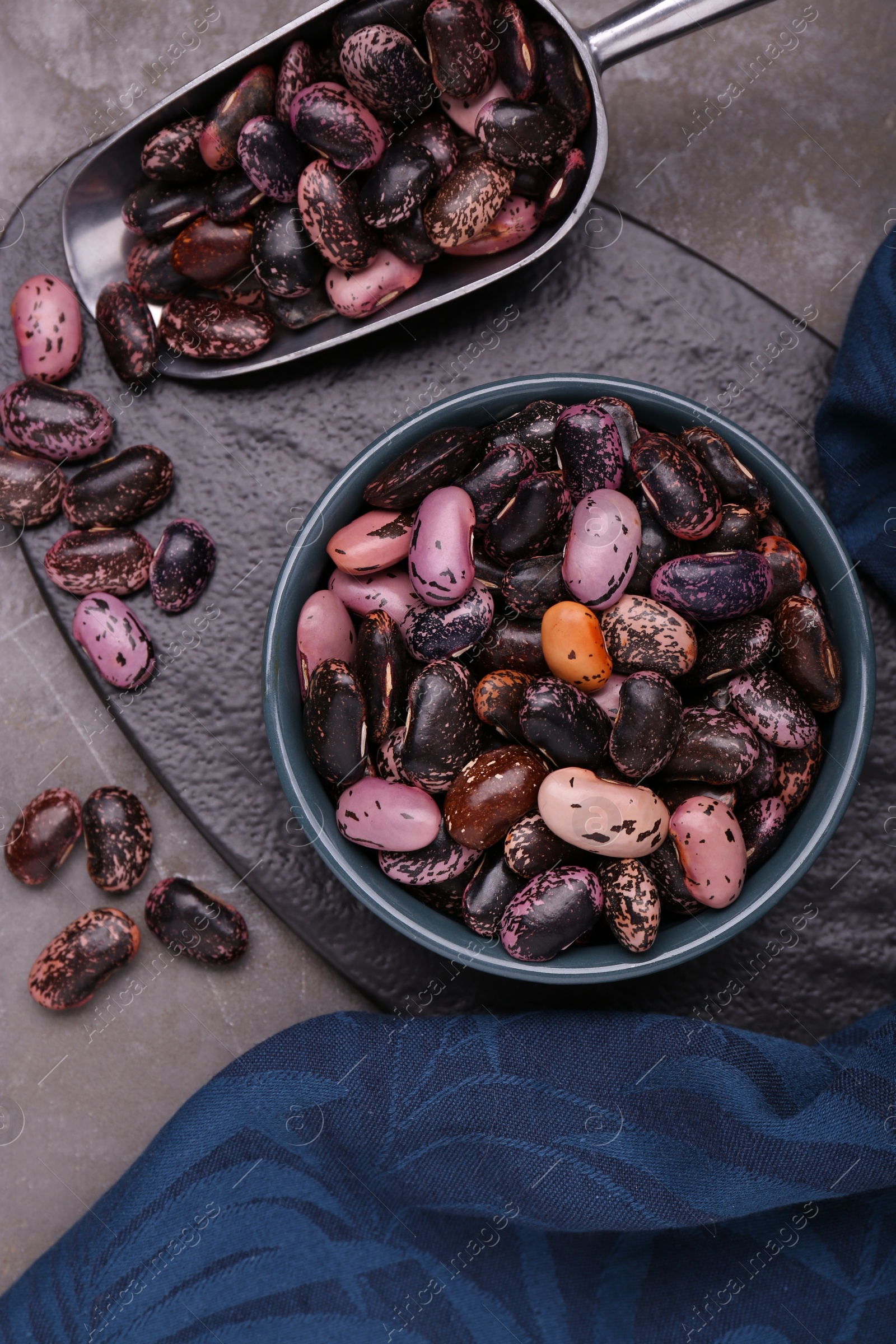 Photo of Many dry kidney beans on grey table, flat lay