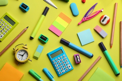 School stationery on yellow background, flat lay. Back to school